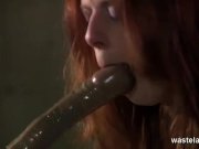 Ginger sex slave gagging on an inserted dildo 13/16