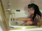 Busty starlet Christy Mack takes a bath  2/16