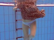 Redhead Katka playing underwater