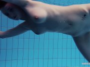 Redheaded Katrin is stripping underwater 15/16