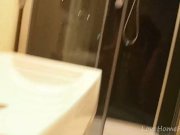 Brunette gets naked and masturbates in the bathroom 9/16