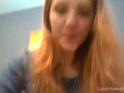 Redhead in a red dress rubs her pussy 1/16