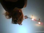 Redhead in a red dress rubs her pussy 3/16