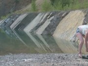 Hot blonde with big tits enjoys the lake 1/16