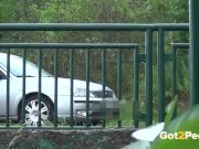 Pee Desperation - Redhead fires piss streams through a railing in public 16/16