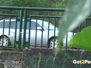 Pee Desperation - Redhead fires piss streams through a railing in public 3/16