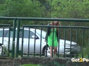 Pee Desperation - Redhead fires piss streams through a railing in public 6/16
