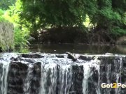 Sexy babe pees near a waterfall 16/16