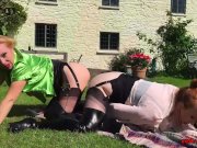 Red and her girlfriend play with a double dildo outside 15/16