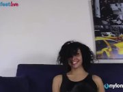 Brunette in stockings takes off her knee high boots 2/16